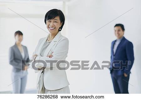 Japanese senior businesswoman with her team View Large Photo Image Stock Photo - Japanese senior businesswoman with her team. Fotosearch