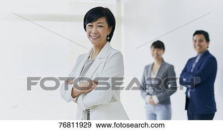 Japanese senior businesswoman with her team View Large Photo Image Stock Photo - Japanese senior businesswoman with her team. Fotosearch