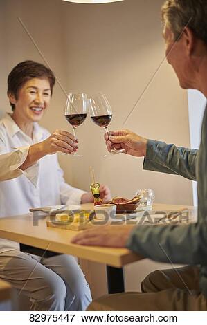 Stock Photo - Japanese senior couple dining. Fotosearch