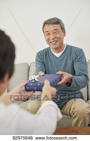 Japanese senior couple exchanging gifts View Large Photo Image Stock Photo - Japanese senior couple exchanging gifts. Fotosearch