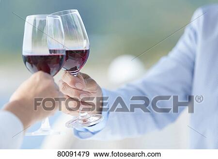 Stock Photo - Japanese senior couple having a drink by the sea. Fotosearch