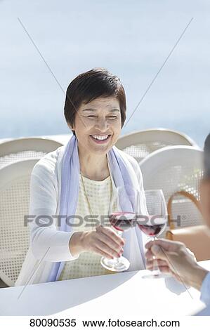 Japanese senior couple having a drink by the sea View Large Photo Image Stock Photography - Japanese senior couple having a drink by the sea. Fotosearch