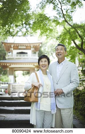 Picture - Japanese senior couple having fun at traditional inn. Fotosearch