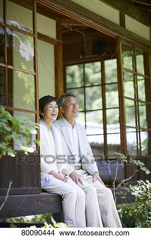 Picture - Japanese senior couple having fun at traditional inn. Fotosearch