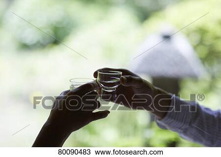 Stock Image - Japanese senior couple having fun at traditional inn. Fotosearch