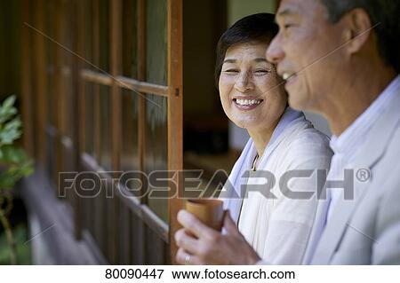 Japanese senior couple having fun at traditional inn View Large Photo Image Stock Photo - Japanese senior couple having fun at traditional inn. Fotosearch