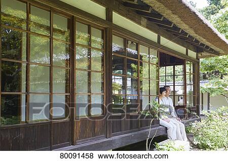Stock Photo - Japanese senior couple having fun at traditional inn. Fotosearch