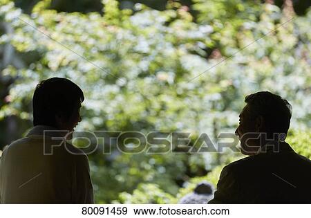 Stock Photo - Japanese senior couple having fun at traditional inn. Fotosearch