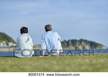 Japanese senior couple having fun by the sea View Large Photo Image Picture - Japanese senior couple having fun by the sea. Fotosearch