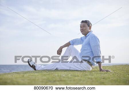 Japanese senior couple having fun by the sea View Large Photo Image Stock Image - Japanese senior couple having fun by the sea. Fotosearch