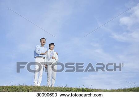 Japanese senior couple having fun by the sea View Large Photo Image Stock Image - Japanese senior couple having fun by the sea. Fotosearch
