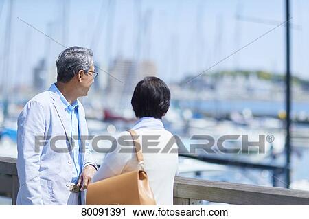 Japanese senior couple having fun by the sea View Large Photo Image Stock Image - Japanese senior couple having fun by the sea. Fotosearch