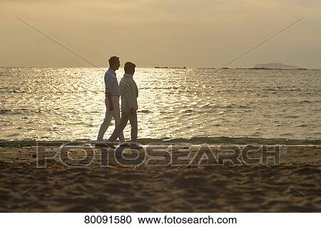 Japanese senior couple having fun by the sea View Large Photo Image Stock Image - Japanese senior couple having fun by the sea. Fotosearch