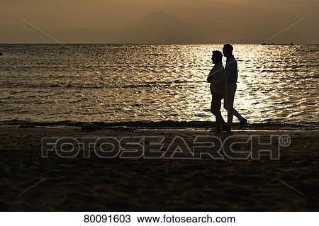 Japanese senior couple having fun by the sea View Large Photo Image Stock Image - Japanese senior couple having fun by the sea. Fotosearch