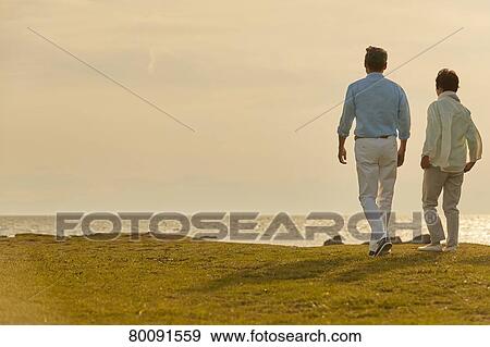 Japanese senior couple having fun by the sea View Large Photo Image Stock Photo - Japanese senior couple having fun by the sea. Fotosearch