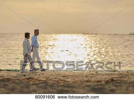Japanese senior couple having fun by the sea View Large Photo Image Stock Photograph - Japanese senior couple having fun by the sea. Fotosearch
