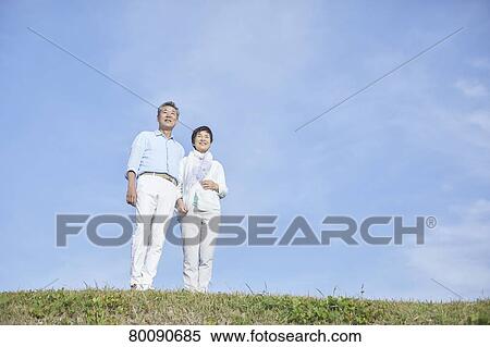 Japanese senior couple having fun by the sea View Large Photo Image Stock Photography - Japanese senior couple having fun by the sea. Fotosearch