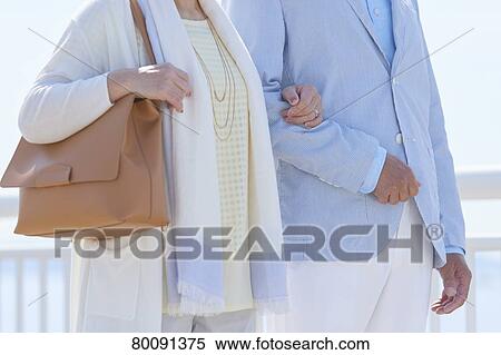 Japanese senior couple having fun by the sea View Large Photo Image Stock Photography - Japanese senior couple having fun by the sea. Fotosearch