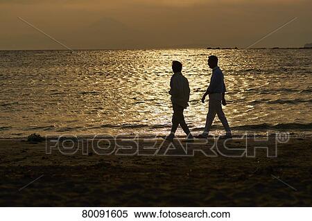 Japanese senior couple having fun by the sea View Large Photo Image Stock Photography - Japanese senior couple having fun by the sea. Fotosearch
