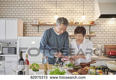 Japanese senior couple in the kitchen View Large Photo Image Stock Photography - Japanese senior couple in the kitchen. Fotosearch