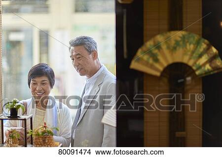 Picture - Japanese senior couple shopping. Fotosearch