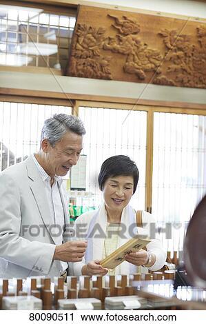 Japanese senior couple shopping View Large Photo Image Stock Image - Japanese senior couple shopping. Fotosearch