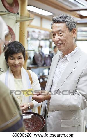 Japanese senior couple shopping View Large Photo Image Stock Image - Japanese senior couple shopping. Fotosearch