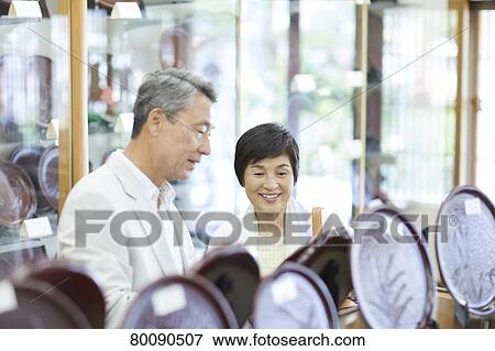 Japanese senior couple shopping View Large Photo Image Stock Photo - Japanese senior couple shopping. Fotosearch