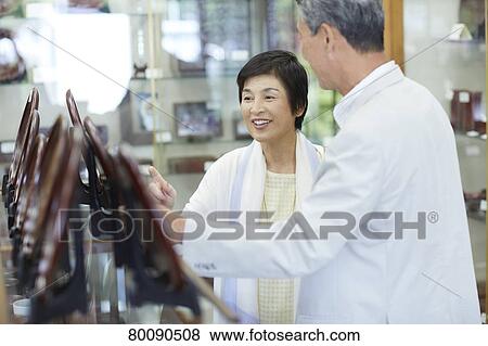 Japanese senior couple shopping View Large Photo Image Stock Photo - Japanese senior couple shopping. Fotosearch