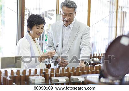 Japanese senior couple shopping View Large Photo Image Stock Photo - Japanese senior couple shopping. Fotosearch
