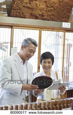 Japanese senior couple shopping View Large Photo Image Stock Photo - Japanese senior couple shopping. Fotosearch