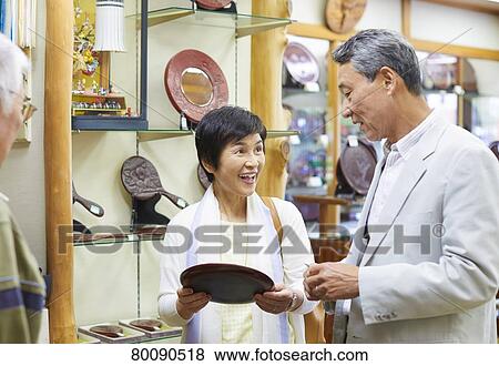 Stock Photo - Japanese senior couple shopping. Fotosearch