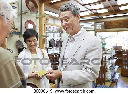 Japanese senior couple shopping View Large Photo Image Stock Photo - Japanese senior couple shopping. Fotosearch