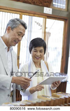 Japanese senior couple shopping View Large Photo Image Stock Photograph - Japanese senior couple shopping. Fotosearch