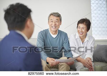Japanese senior couple talking with consultant View Large Photo Image Stock Image - Japanese senior couple talking with consultant. Fotosearch
