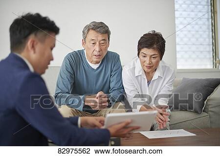 Japanese senior couple talking with consultant View Large Photo Image Stock Image - Japanese senior couple talking with consultant. Fotosearch
