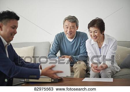 Japanese senior couple talking with consultant View Large Photo Image Stock Image - Japanese senior couple talking with consultant. Fotosearch