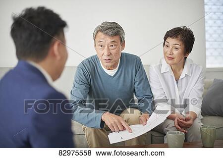 Japanese senior couple talking with consultant View Large Photo Image Stock Photo - Japanese senior couple talking with consultant. Fotosearch