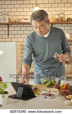 Japanese senior man in the kitchen View Large Photo Image Stock Image - Japanese senior man in the kitchen. Fotosearch