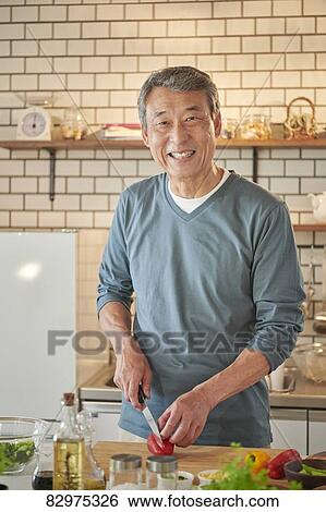 Japanese senior man in the kitchen View Large Photo Image Stock Photograph - Japanese senior man in the kitchen. Fotosearch