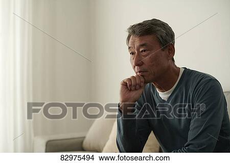 Japanese senior man on the sofa View Large Photo Image Picture - Japanese senior man on the sofa. Fotosearch
