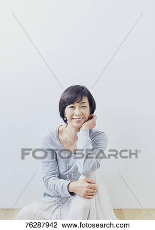 Japanese senior woman against white wall View Large Photo Image Stock Image - Japanese senior woman against white wall. Fotosearch