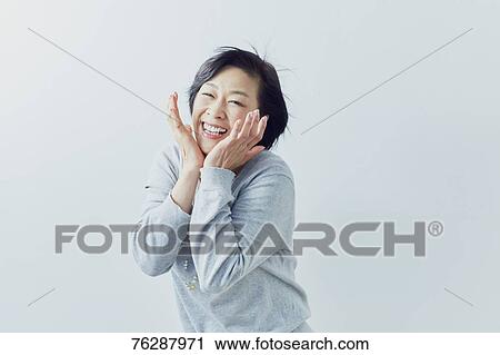 Japanese senior woman against white wall View Large Photo Image Stock Image - Japanese senior woman against white wall. Fotosearch