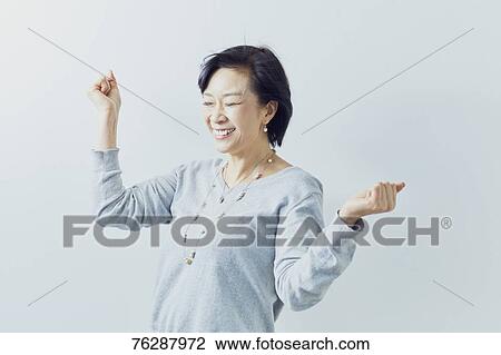 Japanese senior woman against white wall View Large Photo Image Stock Image - Japanese senior woman against white wall. Fotosearch