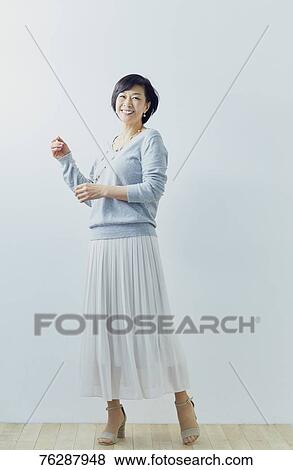 Japanese senior woman against white wall View Large Photo Image Stock Photo - Japanese senior woman against white wall. Fotosearch