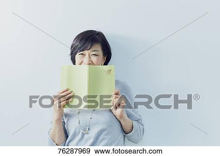 Japanese senior woman against white wall View Large Photo Image Stock Photo - Japanese senior woman against white wall. Fotosearch