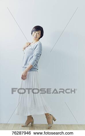 Japanese senior woman against white wall View Large Photo Image Stock Photograph - Japanese senior woman against white wall. Fotosearch