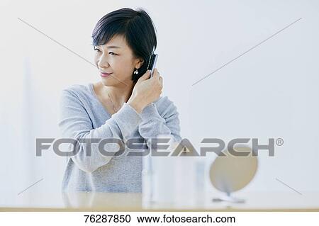 Japanese senior woman doing skin care View Large Photo Image Stock Image - Japanese senior woman doing skin care. Fotosearch