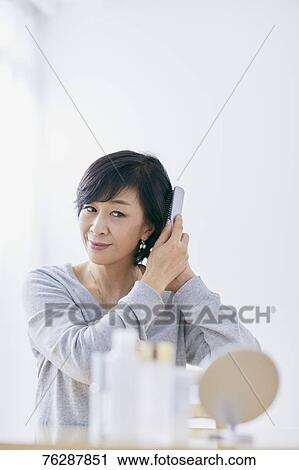 Japanese senior woman doing skin care View Large Photo Image Stock Image - Japanese senior woman doing skin care. Fotosearch