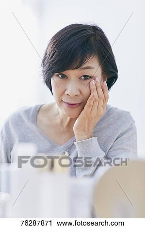 Japanese senior woman doing skin care View Large Photo Image Stock Image - Japanese senior woman doing skin care. Fotosearch